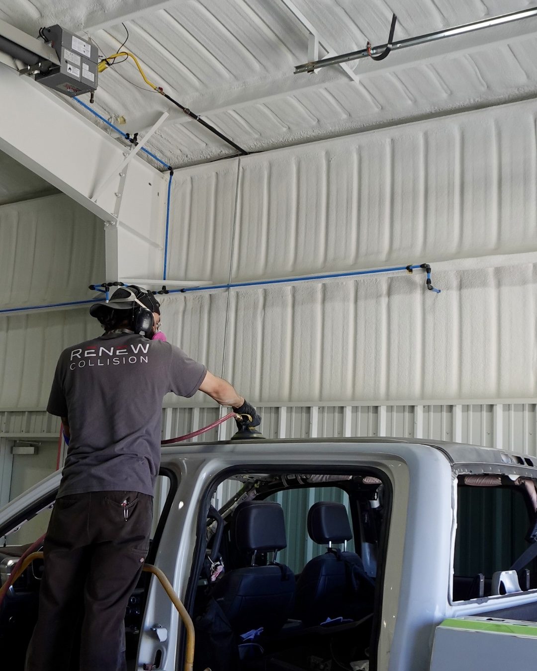 Renew Collision technician working on a pickup truck